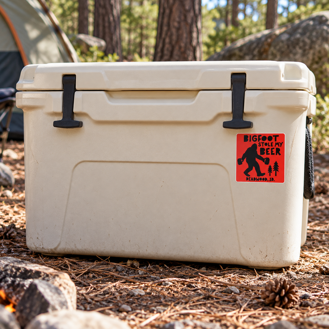 Deadwood Bigfoot Stole My Beer Sticker on a camping cooler — realistic scale lifestyle display; accessories not included
