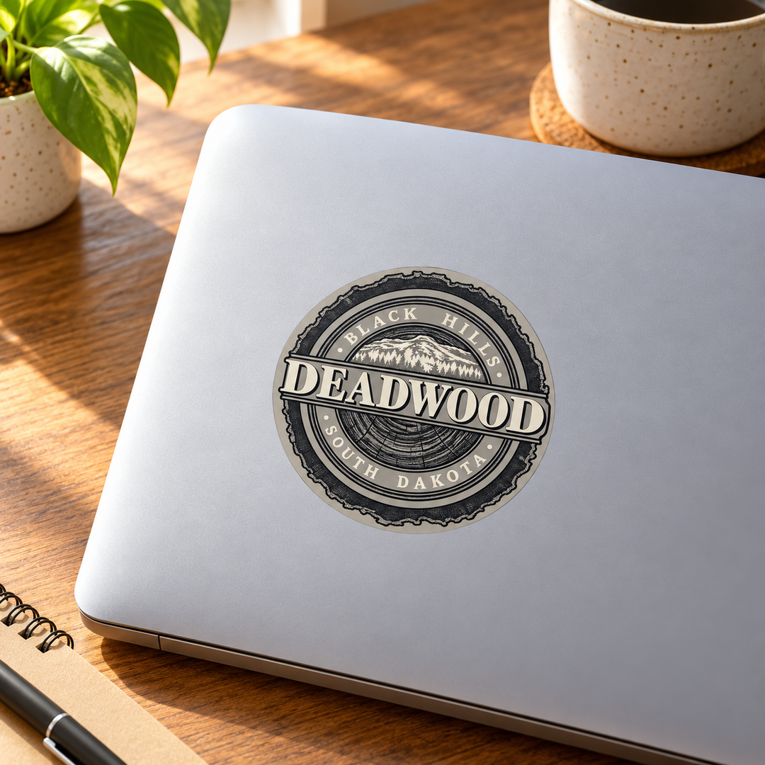 Deadwood Black Hills Woodgrain Mountain Seal Round Sticker on a laptop — lifestyle display mockup; accessories not included