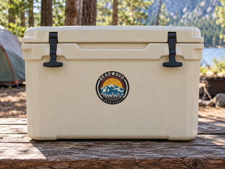 Deadwood Blue Mountain Sunset Round Sticker on a camping cooler at realistic scale