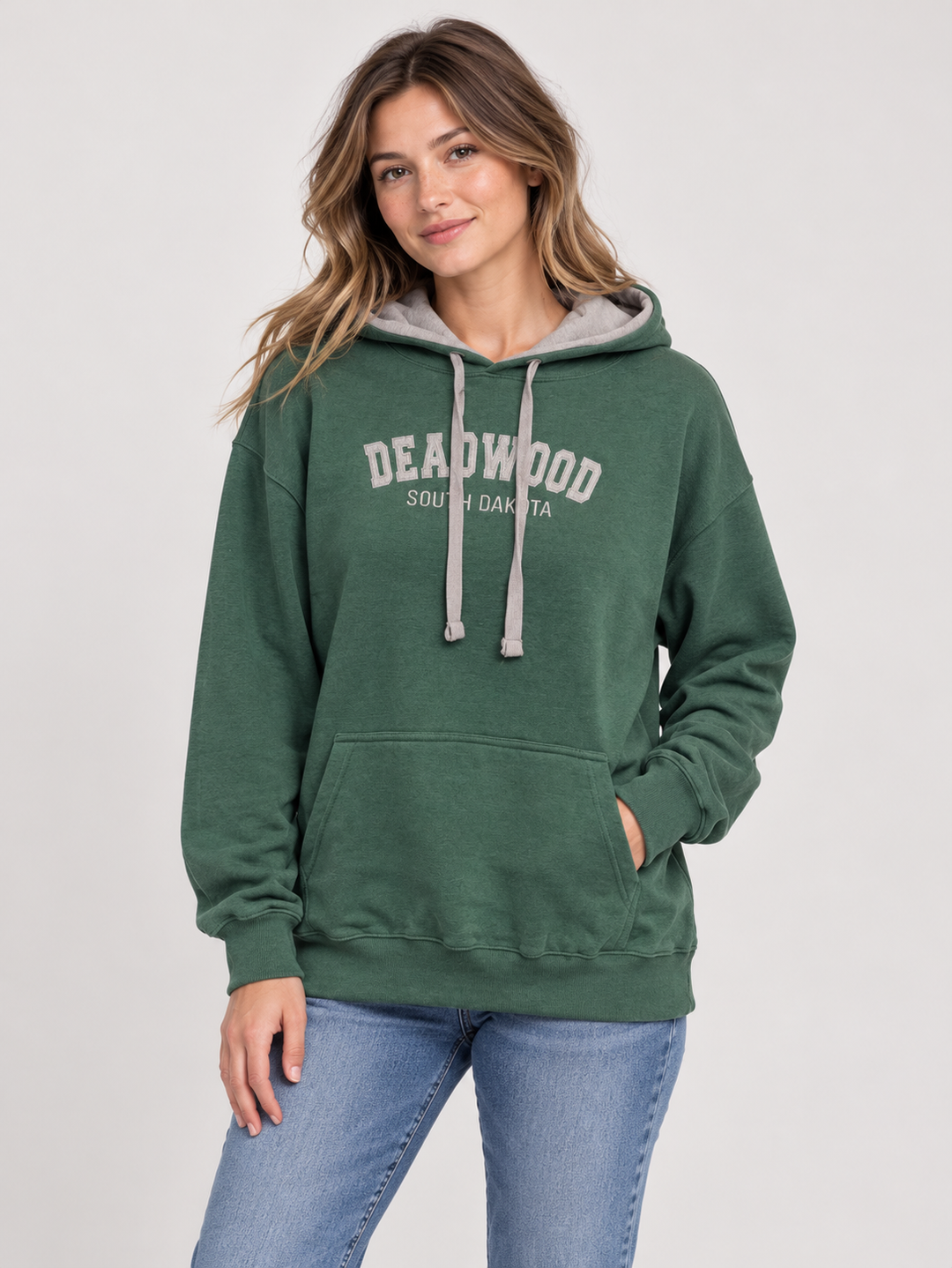AI-generated model wearing forest green Deadwood embroidered hoodie with grey hood lining, front view