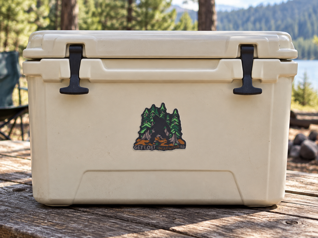 Deadwood Get Lost Bigfoot Pine Forest Sticker on a camping cooler at realistic scale