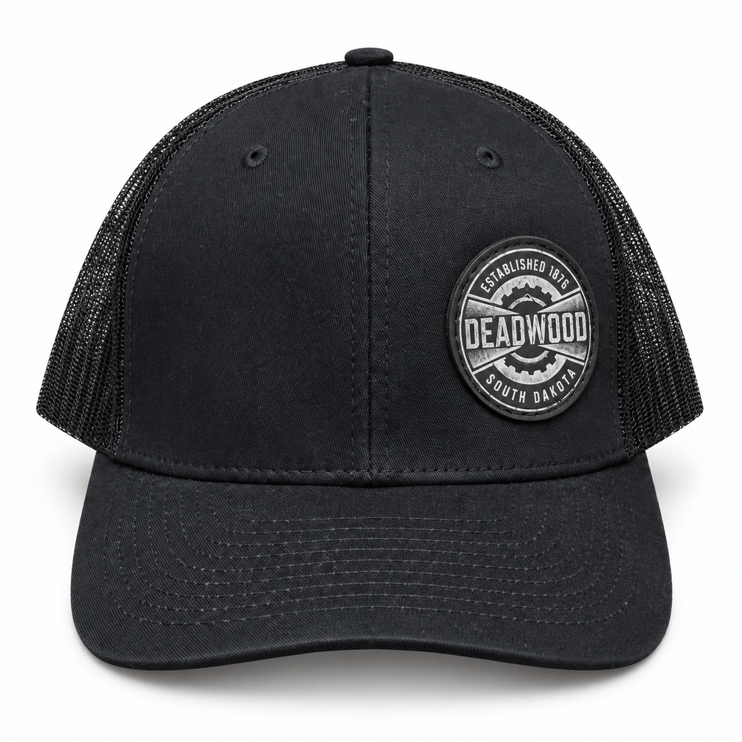 Deadwood Heritage Badge Leather Patch Trucker Hat – Black; front product view