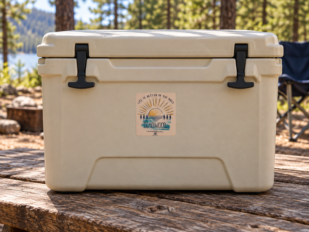 Deadwood Life Is Better in the Hills Sunset Sticker on a camping cooler at realistic scale