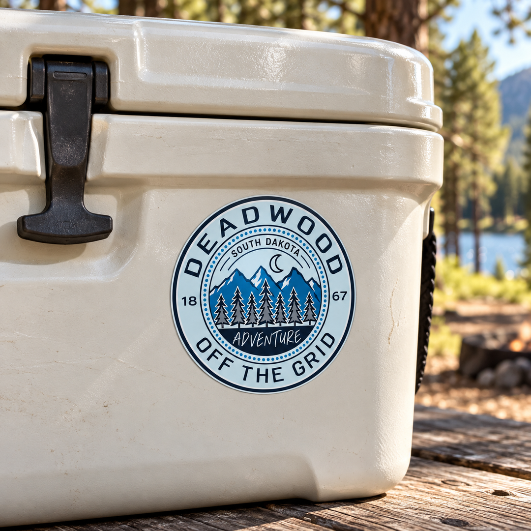 Deadwood Off the Grid Mountain Sticker on a cooler — lifestyle mockup