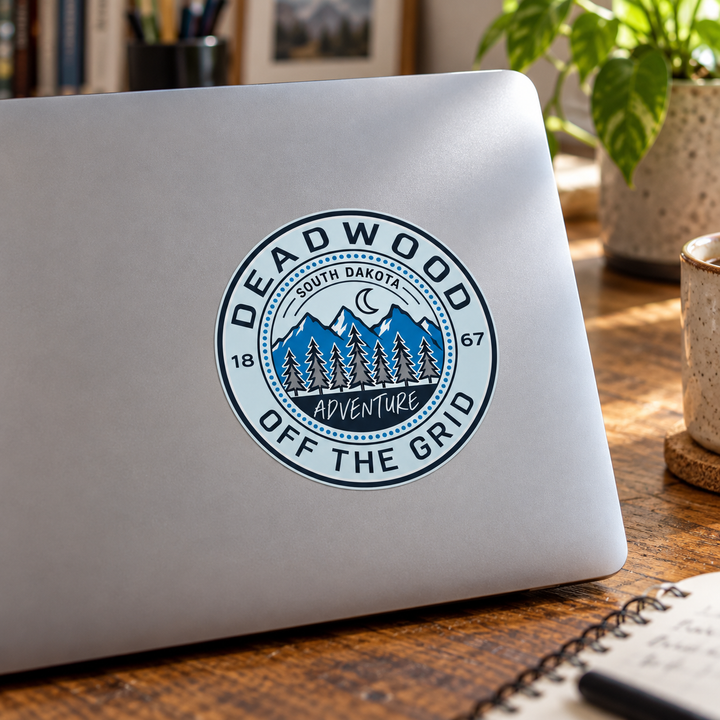 Deadwood Off the Grid Mountain Sticker on a laptop — lifestyle mockup
