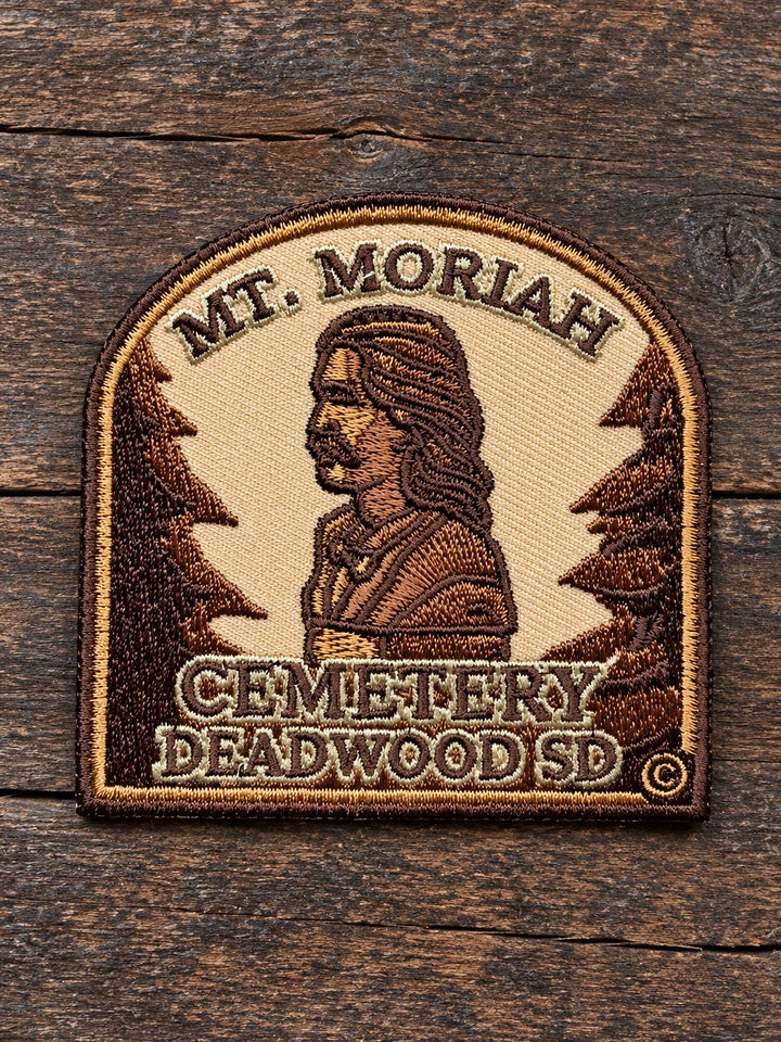 Mount Moriah Cemetery Deadwood Embroidered Patch — on weathered wood