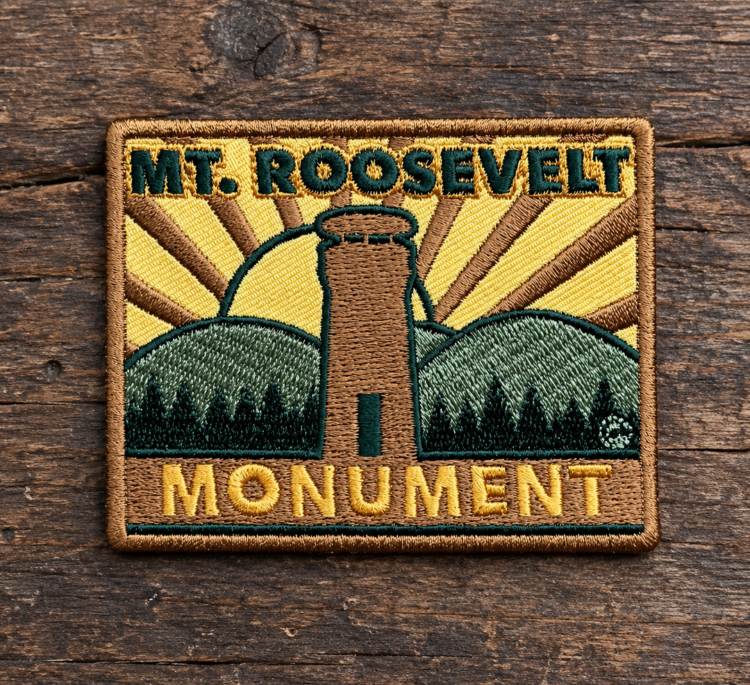 Mount Roosevelt Monument Embroidered Patch — on weathered wood