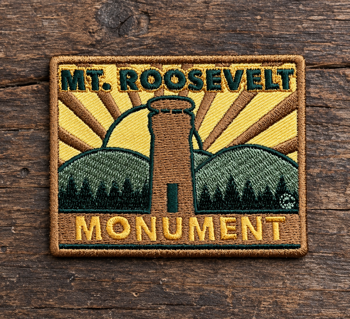 Mount Roosevelt Monument Embroidered Patch — on weathered wood