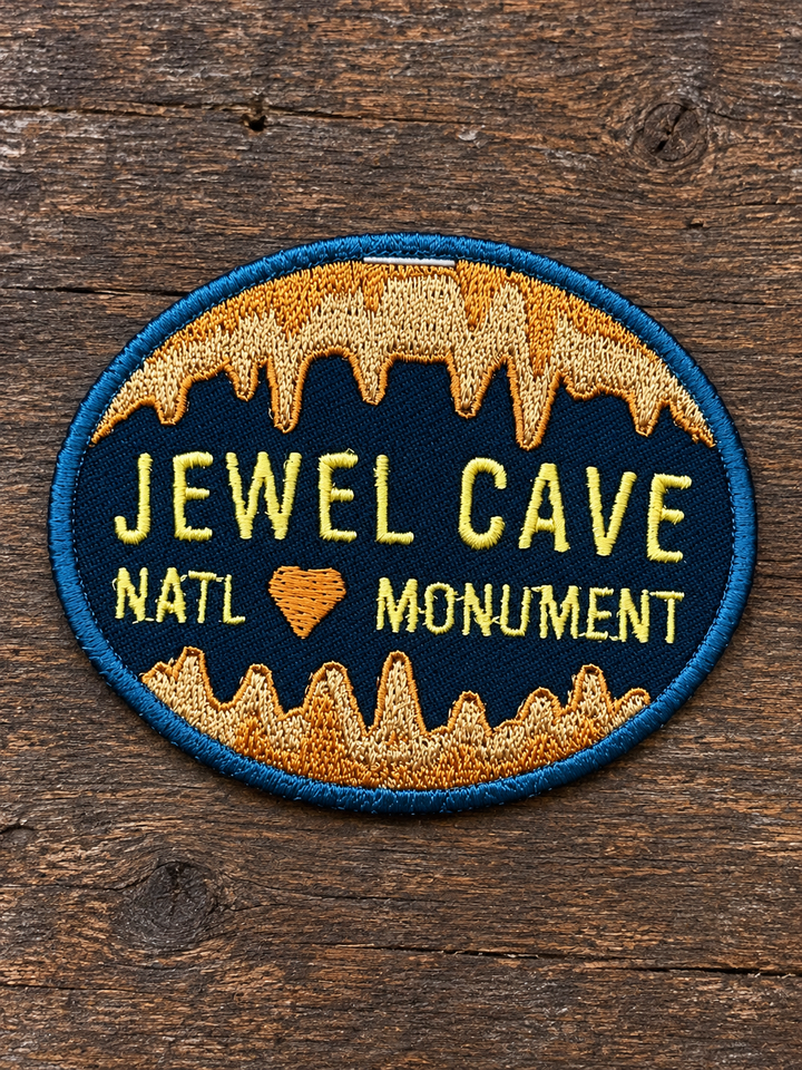 Jewel Cave National Monument Embroidered Patch — on weathered wood