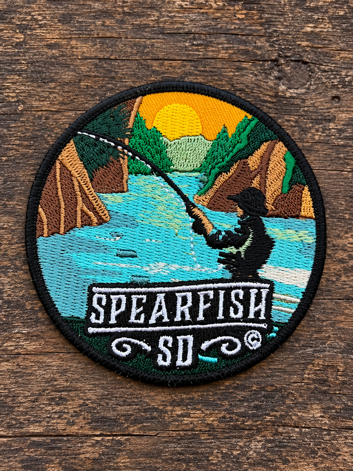 Spearfish South Dakota Fishing Embroidered Patch — on weathered wood
