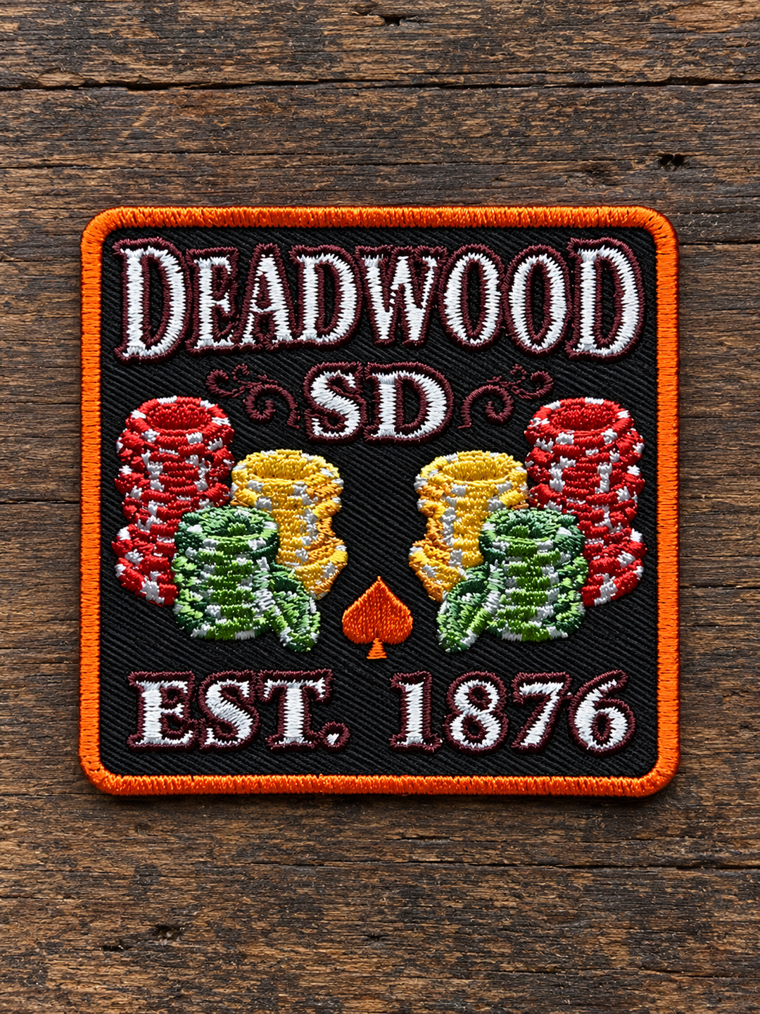 Deadwood Poker Chips Established 1876 Embroidered Patch — on weathered wood