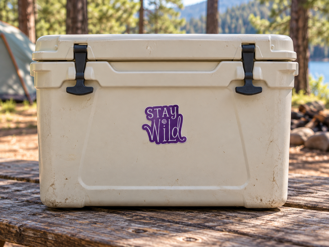 Deadwood Stay Wild Purple Lettering Sticker on a camping cooler at realistic scale