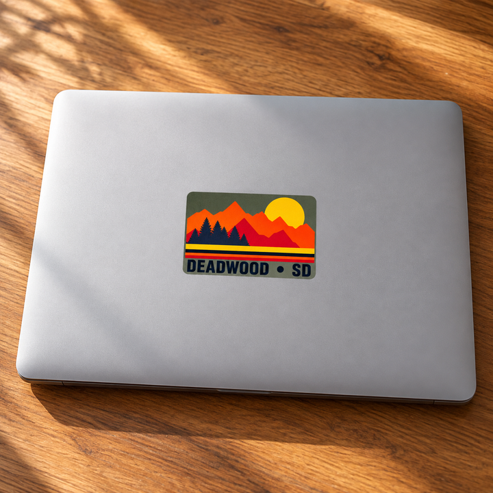 Deadwood Sunset Pines Rectangle Sticker on a laptop — lifestyle display mockup; accessories not included