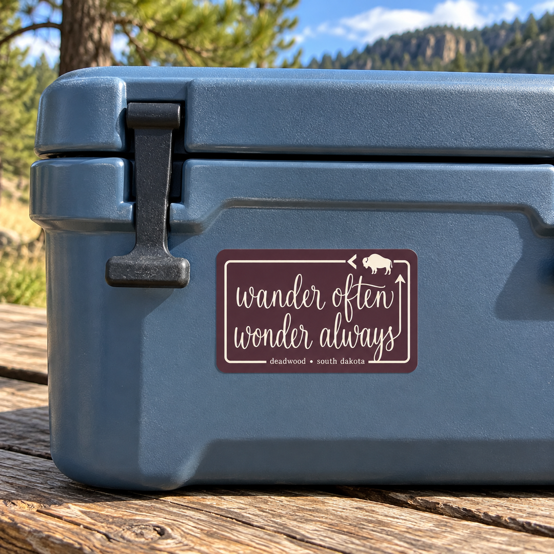 Deadwood Wander Often Wonder Always sticker on a cooler — lifestyle mockup