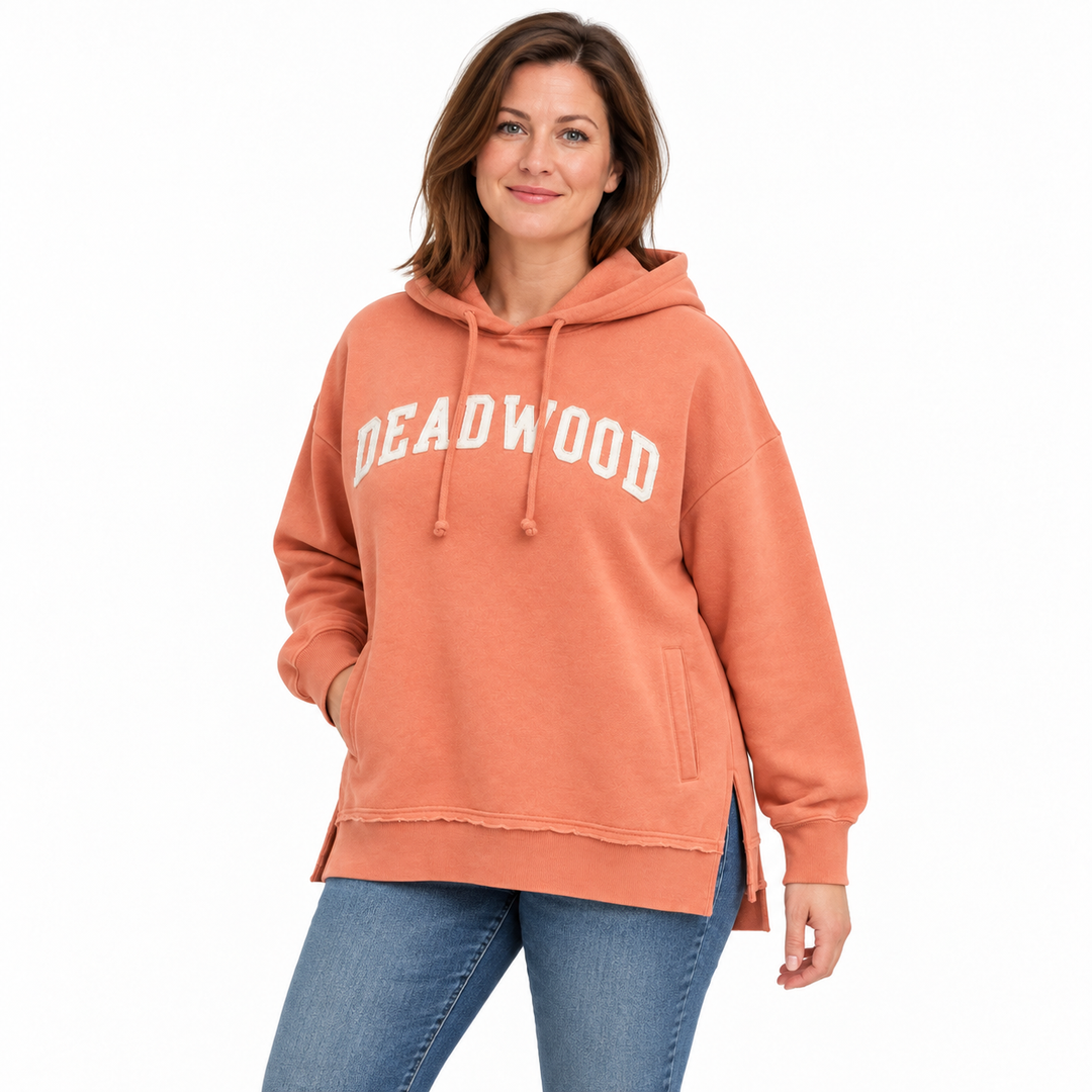 Coral orange Deadwood white applique split-hem hoodie — front model styling preview showing white applique and side slit