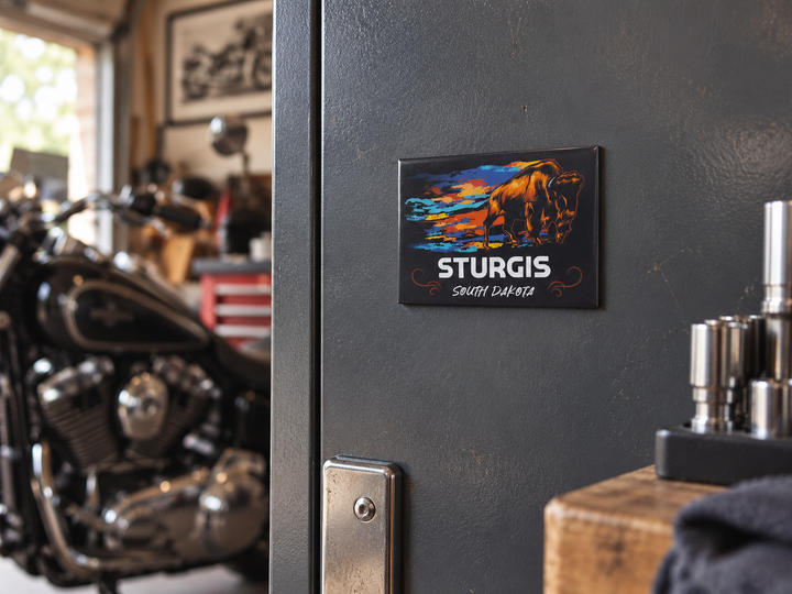 Sturgis Buffalo Souvenir Magnet – South Dakota, displayed on a steel tool cabinet in a home garage