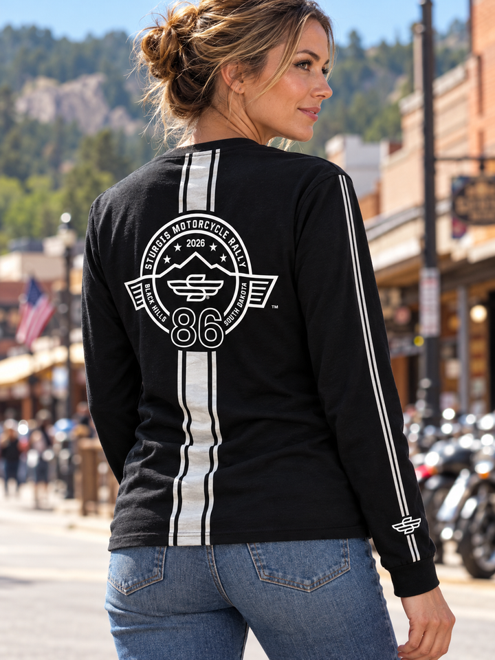 Sturgis 2026 official long sleeve shirt in Black / White Racing Stripes — female model back view