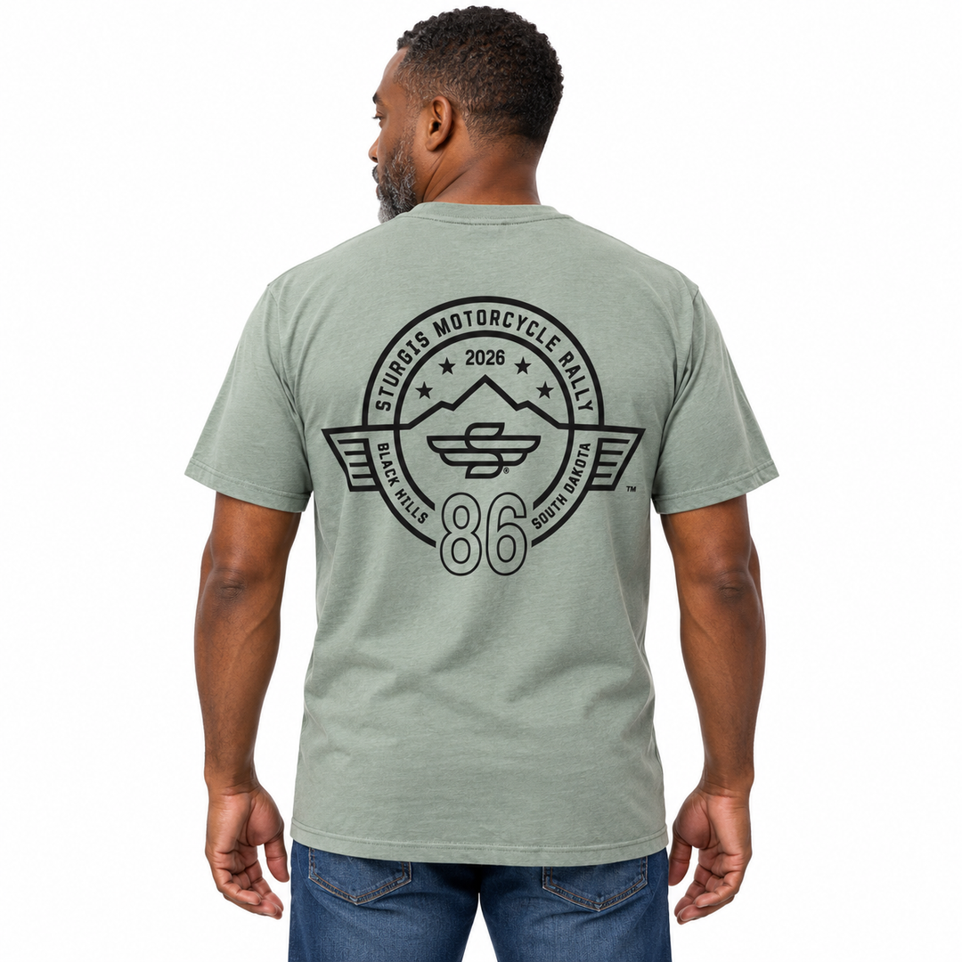 Sturgis 2026 official sage green T-shirt with black Winged-S 86th rally logo — model back view