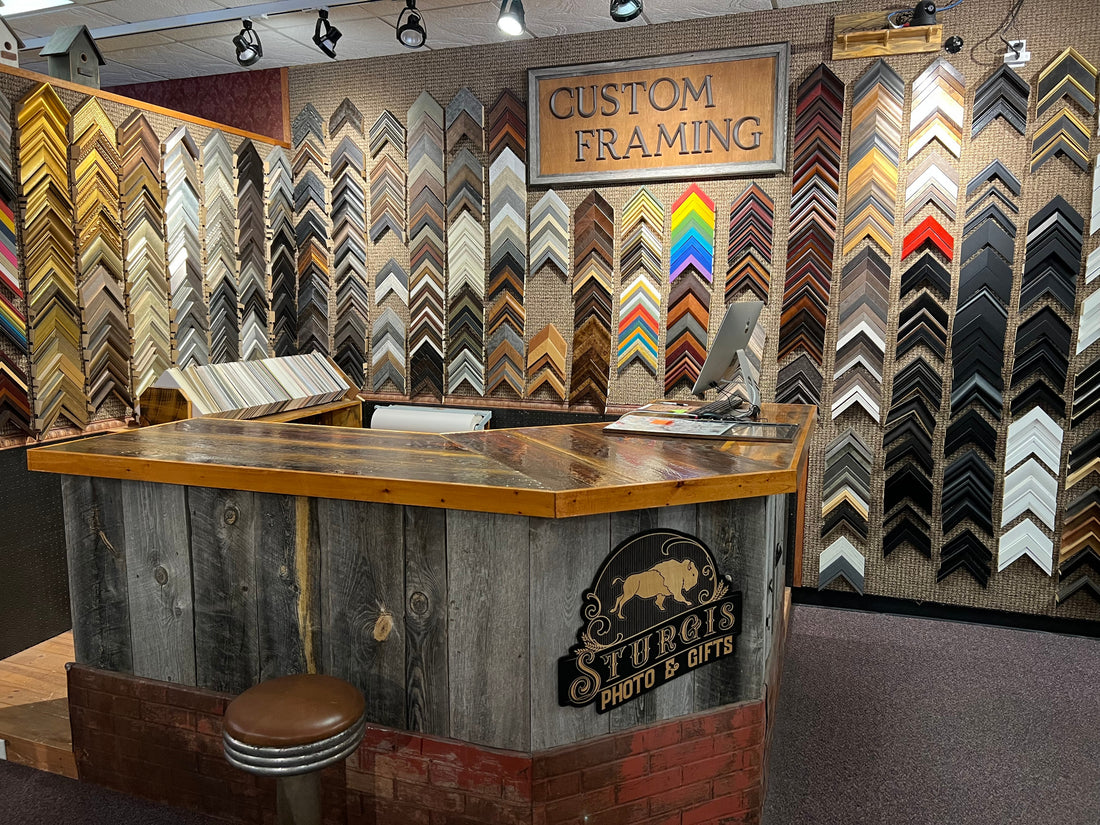 The custom framing counter and frame sample walls at Sturgis Photo & Gifts